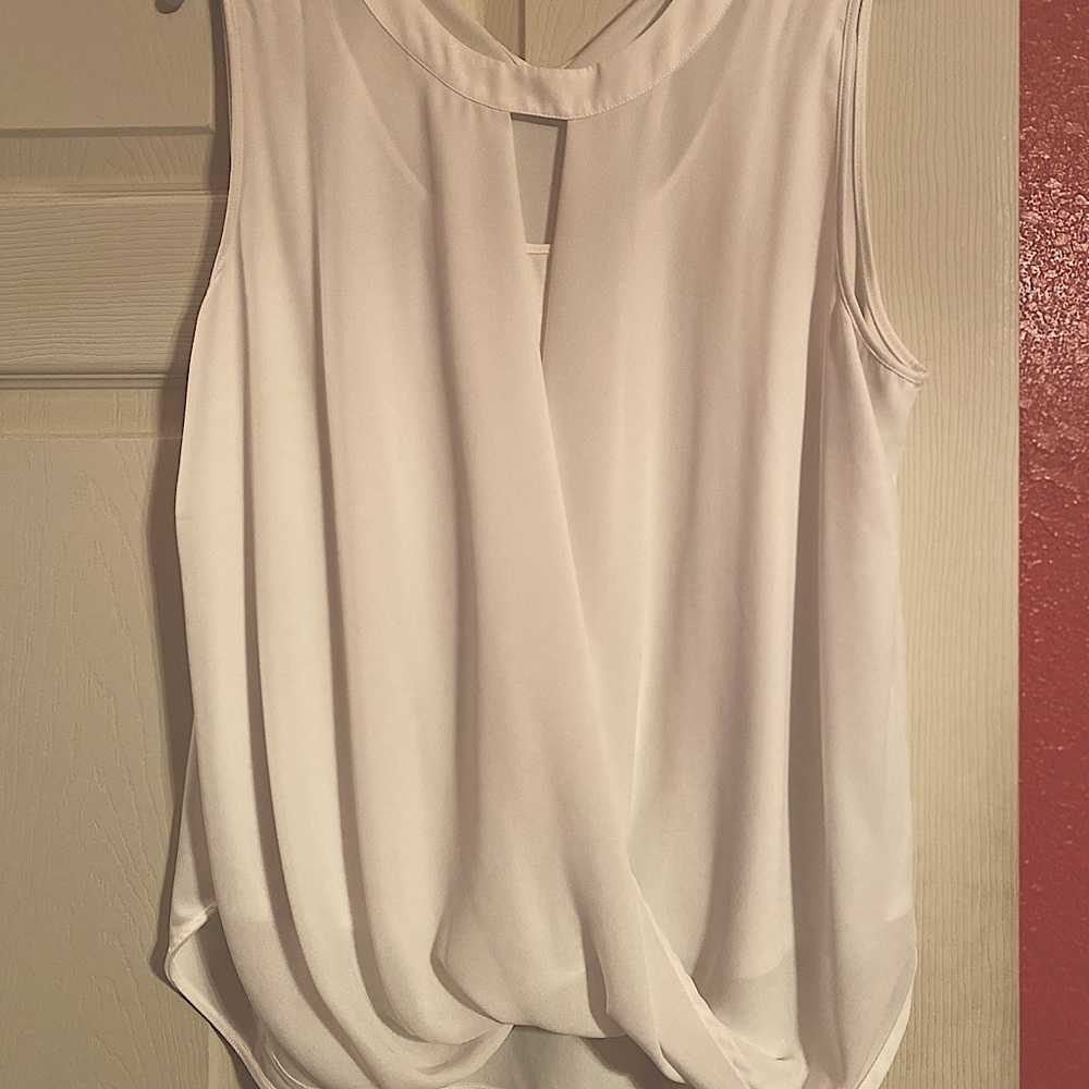 White, sleeveless blouse , high low length